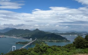 Looking down on a bridge and islands of the Shimanami Kaido route from a high hill