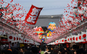 Japanese New Year's decorations and crowds before a temple