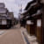 Narrow street lined with traditional Japanese buildings
